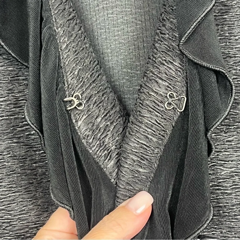 Chico’s black textured ruffled shawl collar single hook closure jacket, medium.